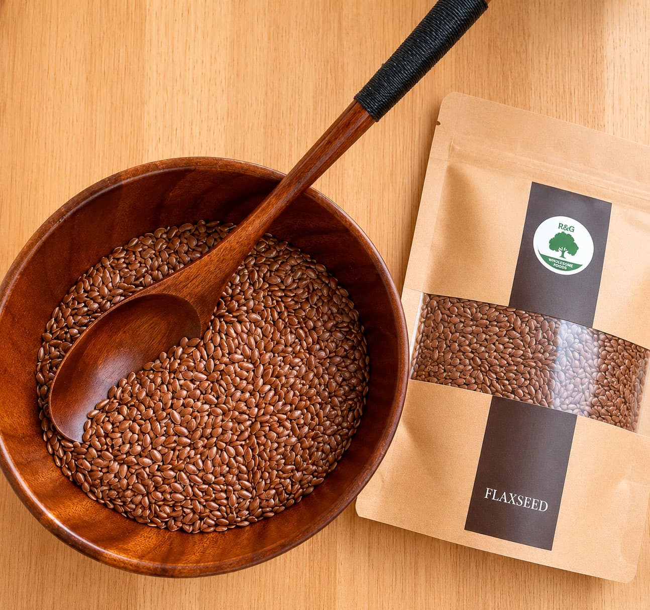 Flaxseed in a wooden scoop beside packaged seeds