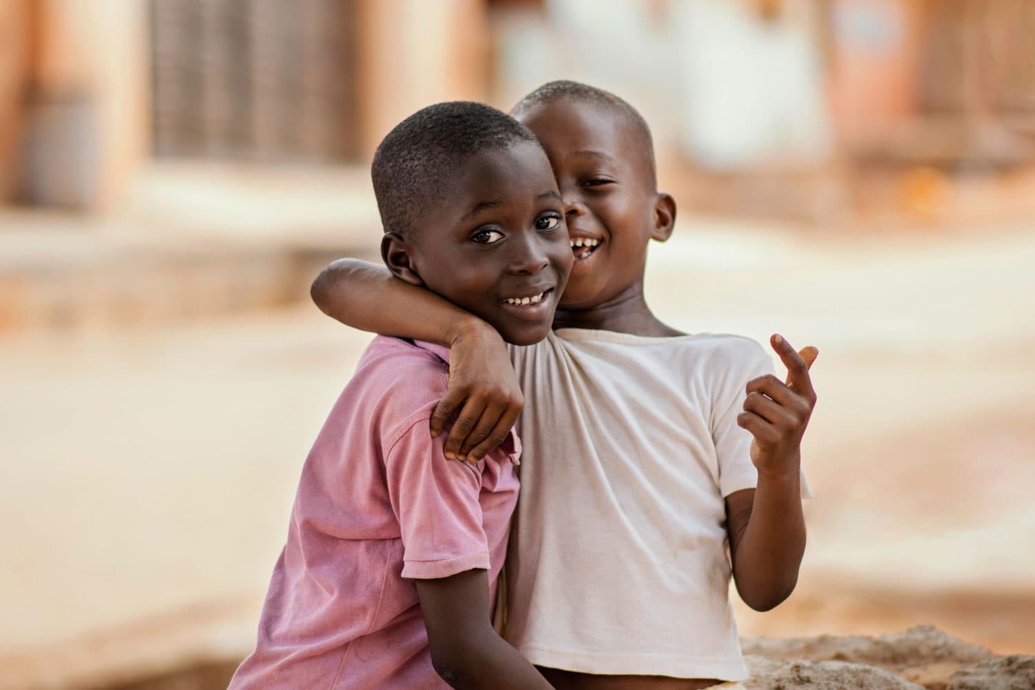 Children smiling together outdoors