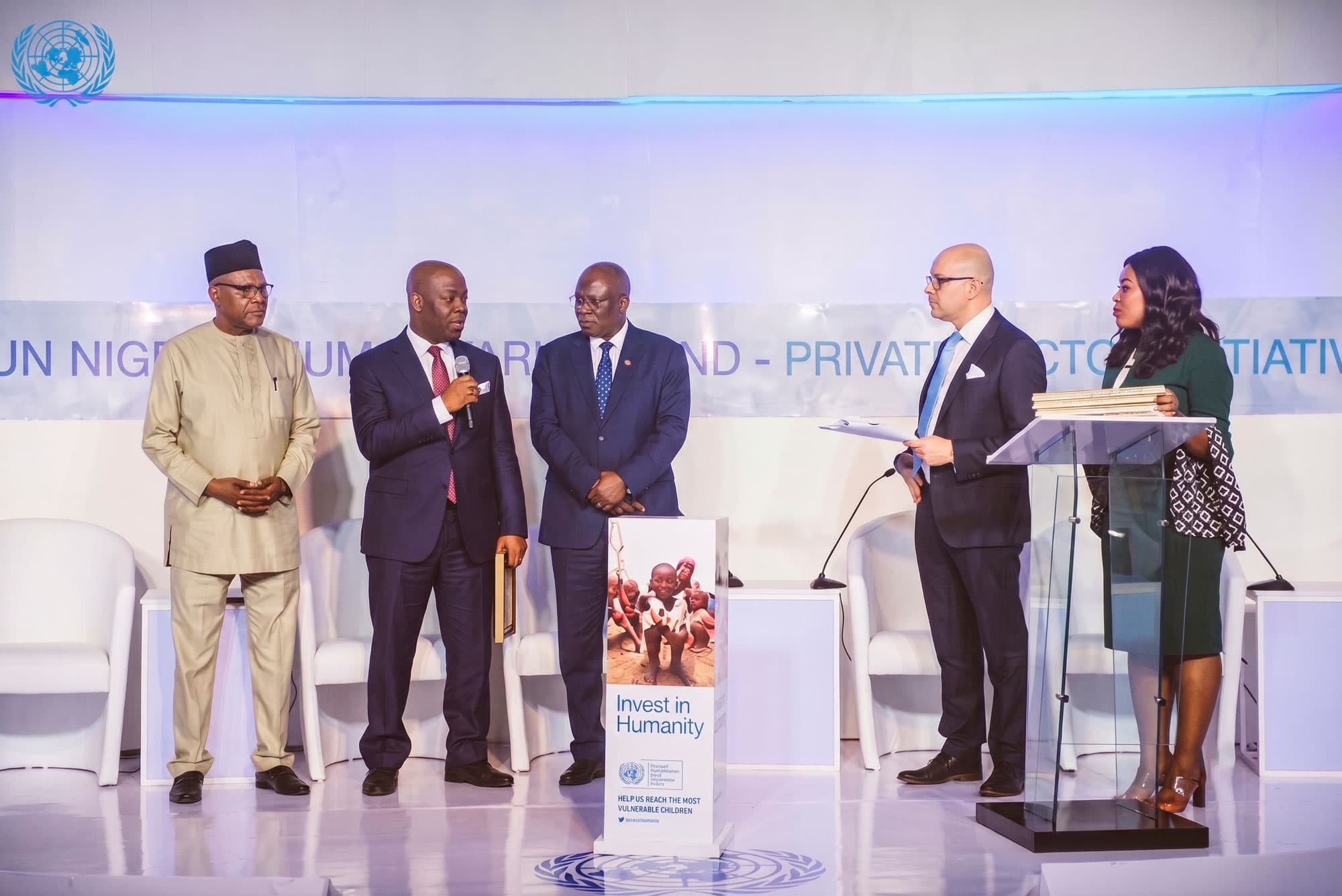 Speakers on stage during a private sector initiative event
