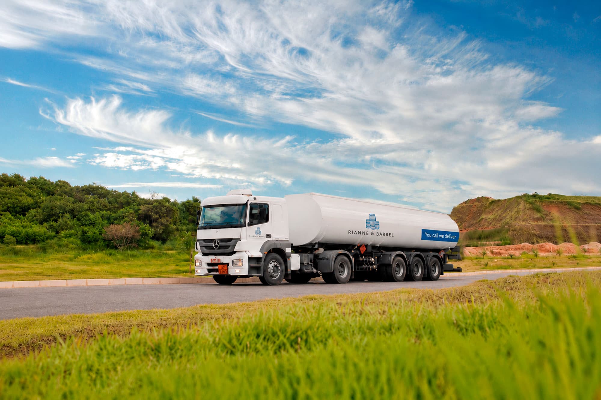 A fuel tanker travelling on an open road