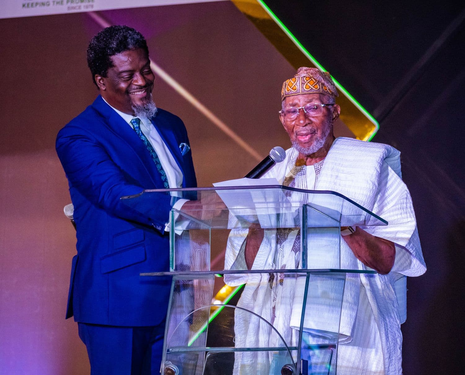 The Anchor presenting alongside an elder at a lectern